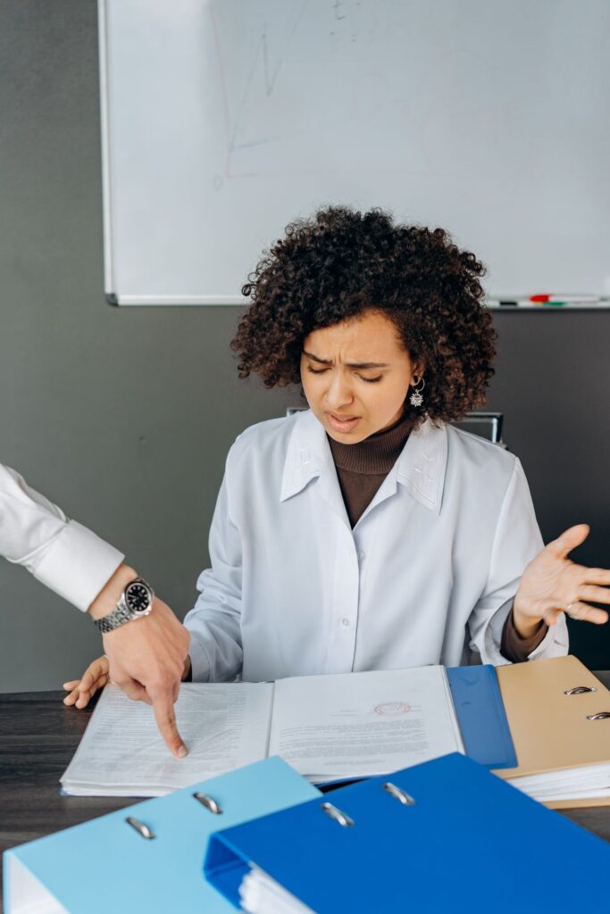 Healthcare administrator reviewing claim denial documents