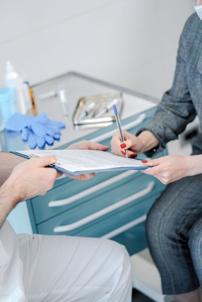 Healthcare provider signing medical credentialing documents