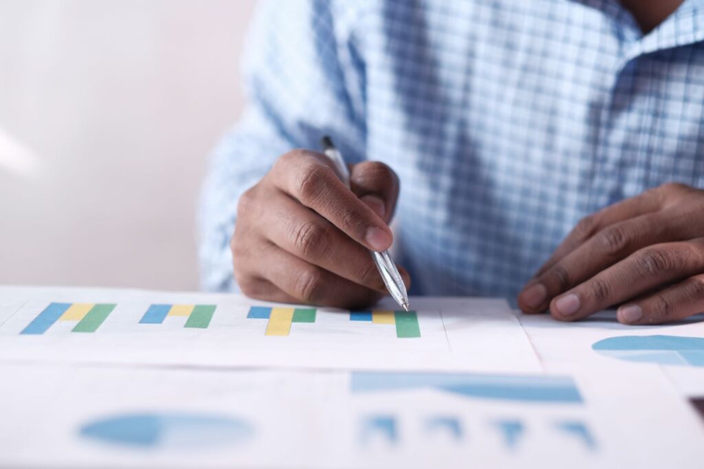 Healthcare administrator reviewing billing report documents