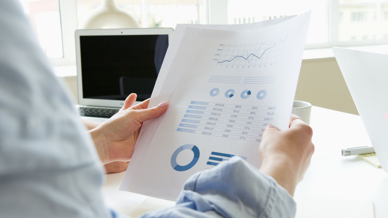 Healthcare provider holding customized medical billing report
