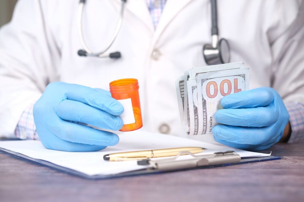 Healthcare staff reviewing medical payment posting documents